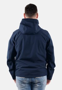 Giacca a zip con cappuccio di colore blu navy, realizzata in materiale liscio e opaco; presenta un taglio morbido e un design semplice con maniche lunghe e senza hardware visibile.