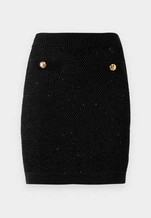 Falda de punto negra con un patrón texturizado, con botones dorados en dos bolsillos laterales y una cinturilla acanalada.