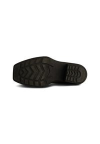 Suela de goma negra con un fondo texturizado, que presenta un patrón en zigzag y ranuras en ángulo para proporcionar tracción, diseñada para la durabilidad y el agarre.