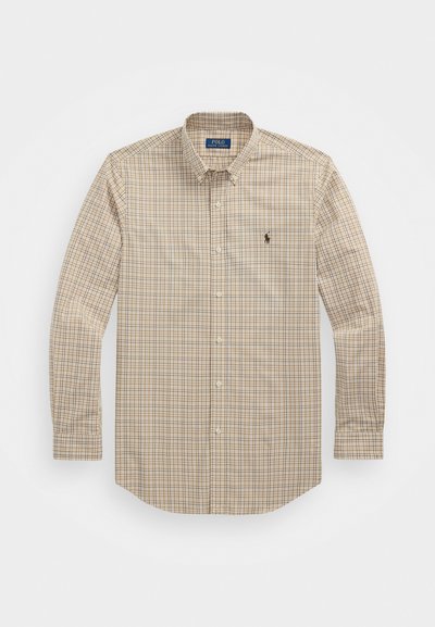 Chemise à manches longues en plaid dans des tons beige et marron, dotée d'un col boutonné et d'un petit logo accentué sur la poitrine.