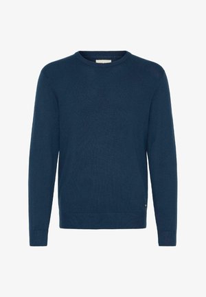 Jersey de cuello redondo en tono navy, confeccionado con un tejido de punto texturizado, que presenta mangas largas y un dobladillo acanalado. Detalle sutil de la marca en la parte inferior izquierda.