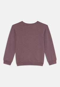 Felpa in mauve tenue, con colletto rotondo, maniche lunghe e polsini e orlo a coste. Tessuto morbido con un design semplice.