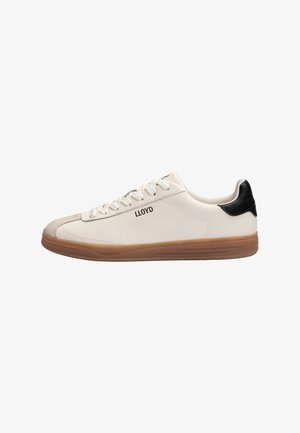 White low-top sneaker with brown sole, black heel tab, beige toe cap, white laces, and "LLOYD" branding on side.
