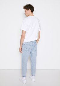 Levi's® STAY LOOSE TAPER CROP - Relaxed fit jeans - royal stonewash