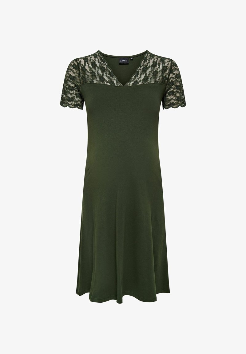 Vihreä mekko, jossa on V-pääntie ja lyhyet pitsihihat. Pehmeä Kangas, liehuva siluetti ja aaltoilevat reunat hihojen helmassa.