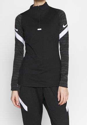 Black athletic top with a quarter-zip design, featuring long sleeves in a striped pattern and white accents on the shoulders.