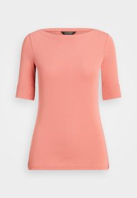 Top corto de color coral claro con escote redondeado, fabricado en suave tejido de algodón. Cuenta con puños enrollados y una silueta ajustada.