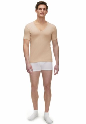 Beige short-sleeve V-neck T-shirt, smooth fabric, fitted design, paired with white boxer briefs, model standing with neutral pose.