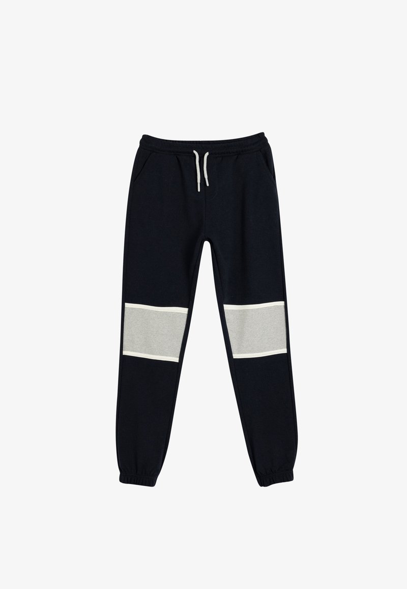 Marineblauwe sweatpants met elastische tailleband en trekkoord, voorzien van grijze panelen op de onderbenen, zijzakken en boordjes aan de enkels.