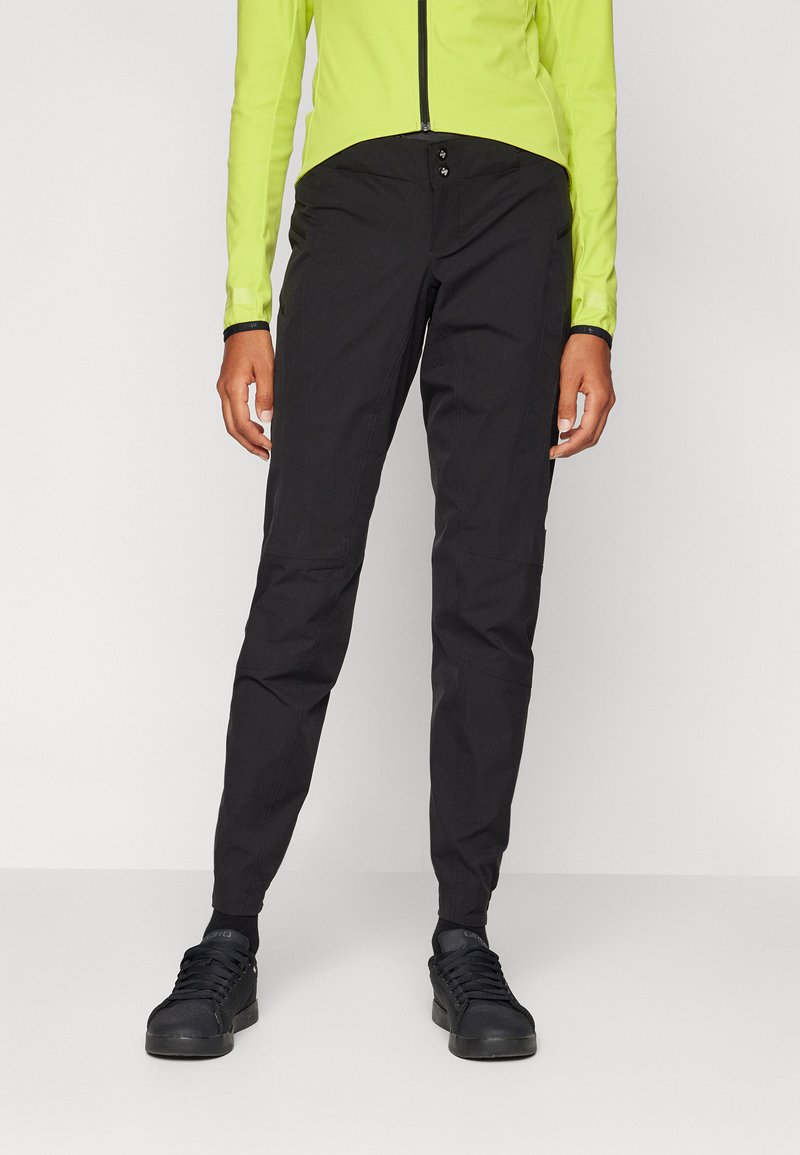 Sorte slim-fit bukser med en glat tekstur, to frontlommer og knaplukning i taljen. Velegnet til casual eller aktiv brug.