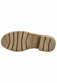 Brun gummisål med flere riller og forhøjninger. Har præget logo og teksten "MADE IN ITALY" samt en lille italiensk flag accent.