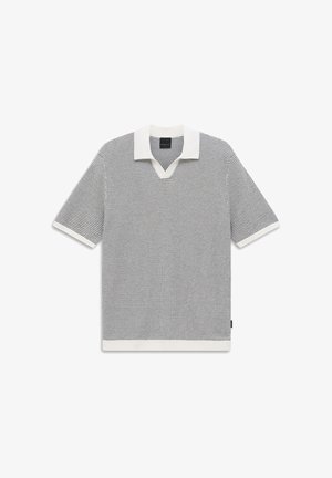 Kurzärmliges, gestricktes Polohemd in Schwarz-Weiß-Muster mit weißem Kragen, Ärmelbündchen und Saum.