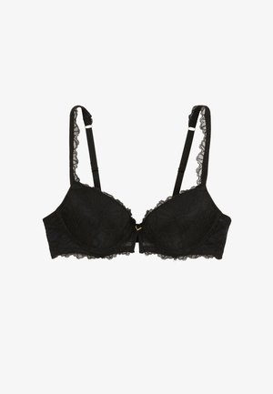 Soutien-gorge en dentelle noire avec des motifs floraux, des bretelles réglables, un détail en métal doré au centre et des bords en dentelle festonnée.