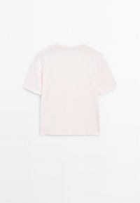 Short-sleeve t-shirt in soft pink cotton with a classic crew neck and straight cut, featuring no visible graphics or patterns.