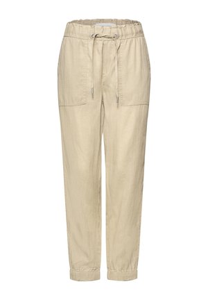 Beżowe spodnie ze sznurkiem, elastycznym pasem i ściągaczami, z dwoma dużymi naszywanymi kieszeniami z przodu oraz luźnym, zwężanym krojem.