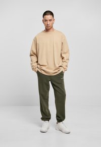 Urban Classics HEAVY OVERSIZED LONGSLEEVE - Bluză de molton - unionbeige