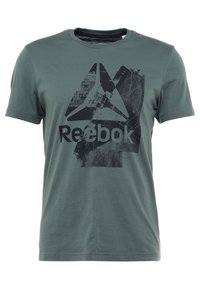 Zelené tričko s krátkým rukávem a kulatým výstřihem, na přední straně s velkým opotřebovaným černým logem Reebok a názvem značky.