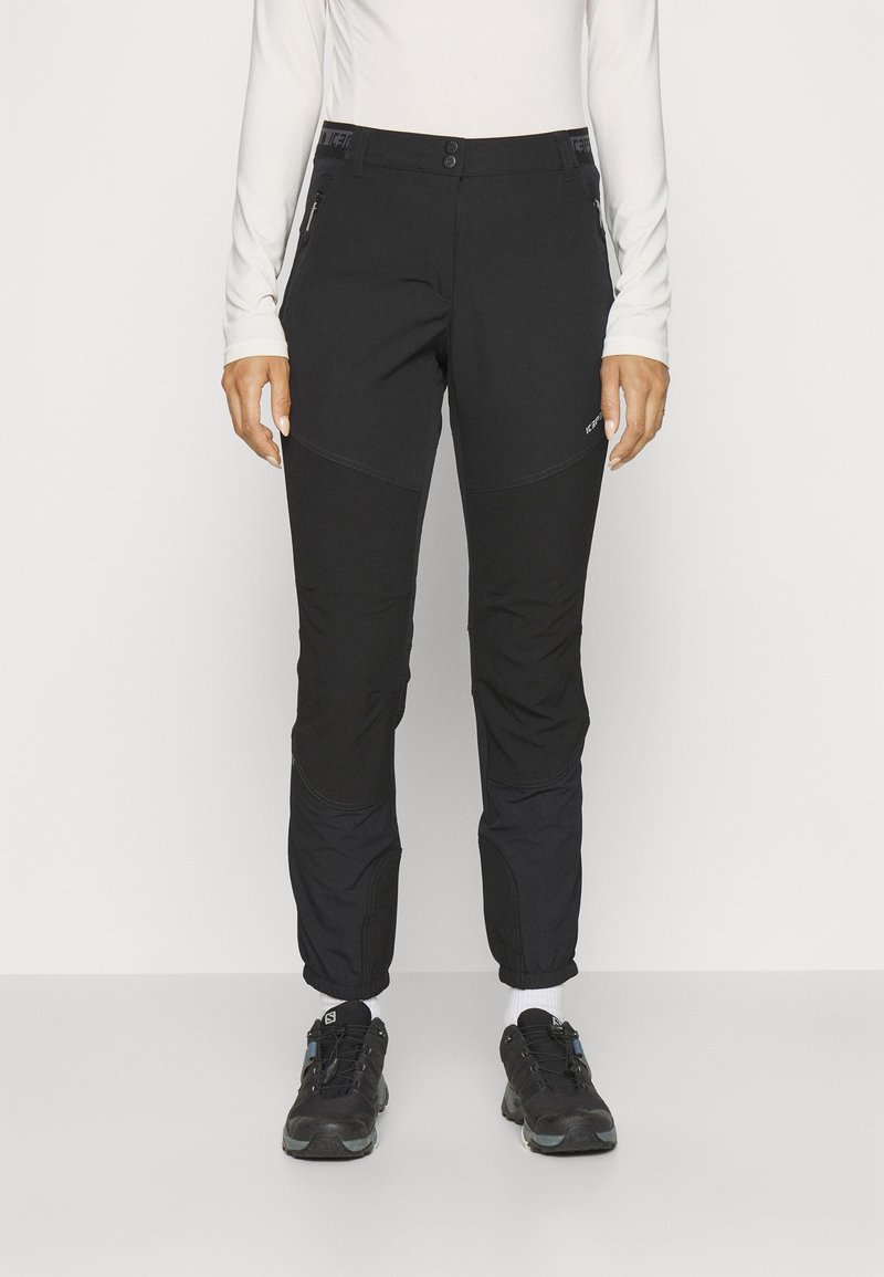 Mustat ulkoiluhousut, joissa on tyylikäs muotoilu, vetoketjullinen tasku, vahvistetut osat ja elastiset hihnat. Valmistettu kestävästä ja joustavasta materiaalista.