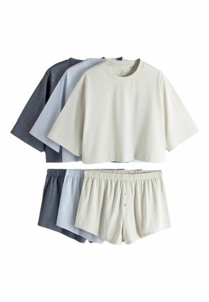 Three sets of casual loungewear with cropped short-sleeve tops and elastic waist shorts in cream, light blue, and dark gray colors.