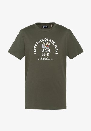 T-shirt vert olive avec texte blanc "INTERMEDIATE MA-1 U.S.N. 19-13 Schott Bros inc" et un graphisme d'un tigre rugissant sur la poitrine.