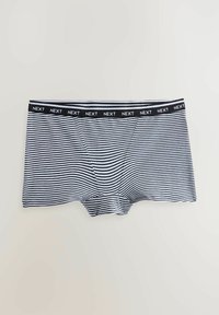 Black and white striped boxer shorts with a black elastic waistband labeled "NEXT." Soft fabric with a smooth texture and fitted shape.