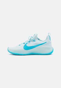 Light blue athletic shoe with textured mesh upper, blue swoosh logo, and a rubber sole that transitions from light blue to white.