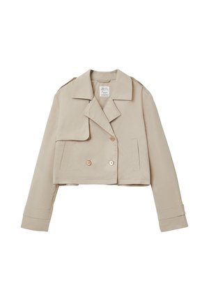 Veste beige courte à double boutonnage avec de larges revers, manches longues et deux poches avant.