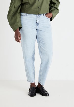 Light blue denim jeans with a relaxed fit, featuring a high waist and slight distressing on the front. Paired with black woven shoes.