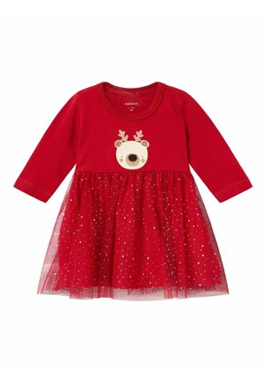 Abito rosso con maniche lunghe, caratterizzato da un design di renna su un top morbido e una gonna in tulle trasparente e luccicante.