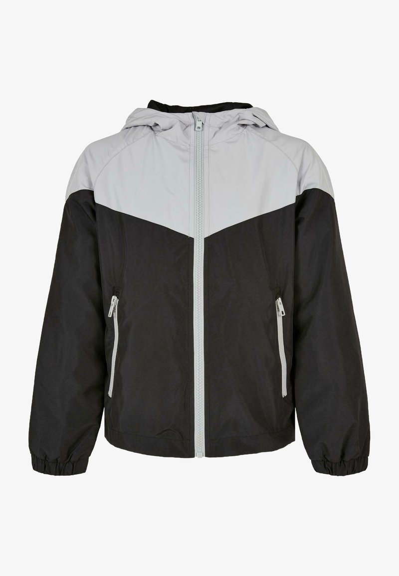 Giacca con cappuccio nera e grigia caratterizzata da chiusura con zip frontale, polsini elastici e due tasche laterali con zip; realizzata in materiale liscio e leggero.