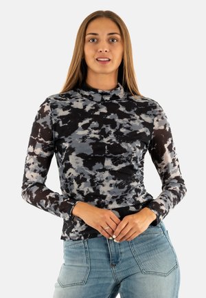 Top a maniche lunghe con collo alto in un motivo astratto di nero, grigio e bianco, caratterizzato da un design aderente e un tessuto morbido e elasticizzato.