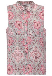 Chemisier sans manches bleu clair avec un motif floral rose et rouge. Doté d'un col et d'une fermeture à boutons sur le devant.