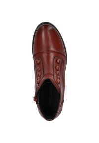 Bruine leren enkellaars met een ronde neus, zijrits en decoratieve knopen langs de bovenkant. Interieur met merknaam. Platter zool.