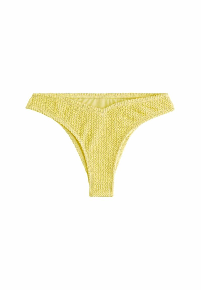 Keltainen bikinin alaosa, jossa on teksturoidu kudoskuvio, V-muotoinen etuosa ja saumatonta reunaa mukavuutta varten. Sopii uima-asuksi.