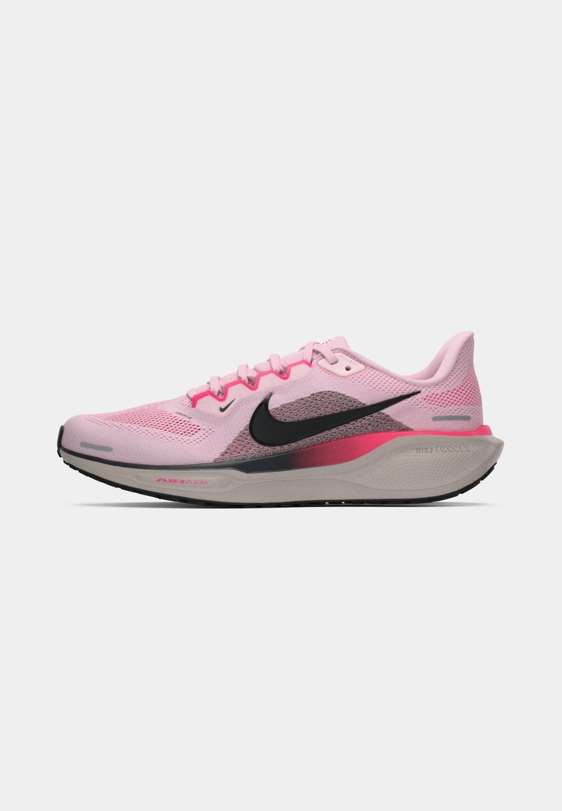 Nike running shoe in shades of pink and gray, featuring a mesh upper, black logo, and a cushioned, textured sole for support.