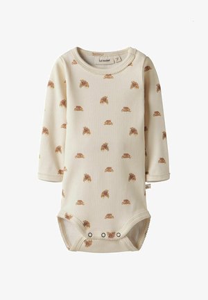 Bodysuit pour bébé à manches longues en tissu crème à côtes, avec un motif de croissants éparpillés et des pressions en bas.
