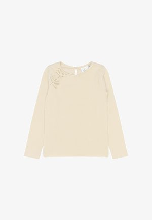 Top à manches longues en jersey côtelé de couleur beige clair, présentant un dos avec une découpe en forme de clé et deux nœuds décoratifs sur l'épaule gauche pour un détail supplémentaire.