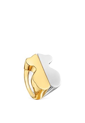 Anillo bicolor de oro y plata con forma abstracta y acabado pulido sobre fondo blanco.