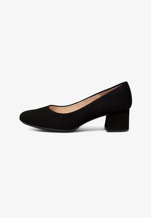 Zapato de mujer negro de tacón bajo con punta redondeada y tacón grueso, con acabado mate suave y forro interior beige.