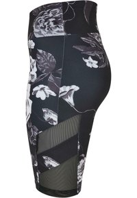 Høyt midjesvarende svarte leggings med blomstermønster i grått og hvitt, med mesh-paneledetaljer og en smal passform.