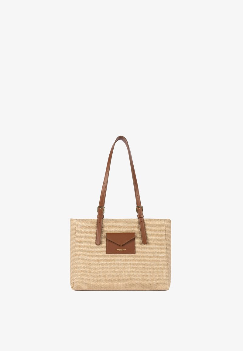 Sac cabas beige tissé avec deux anses en cuir marron et une petite poche en cuir marron à l'avant avec le logo Lancaster.
