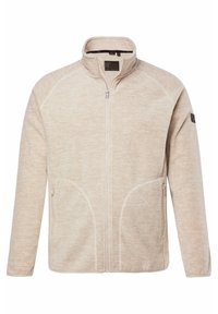 Chaqueta cremosa con cierre de cremallera y cuello alto, con dos bolsillos laterales y un tejido suave y texturizado. Presenta costuras en contraste y un logo en la manga.