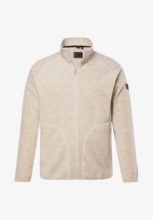 Chaqueta cremosa con cierre de cremallera y cuello alto, con dos bolsillos laterales y un tejido suave y texturizado. Presenta costuras en contraste y un logo en la manga.