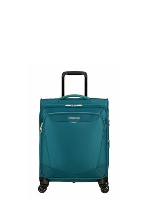 Valigia morbida American Tourister color teal con maniglia telescopica, tasca frontale con cerniera e quattro ruote girevoli nere.