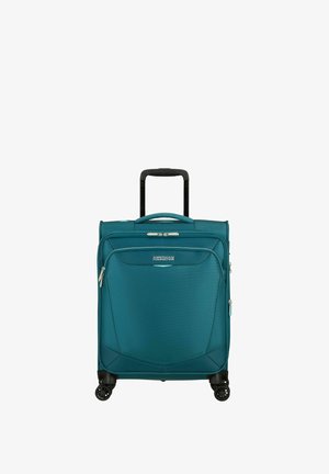 Valigia morbida American Tourister color teal con maniglia telescopica, tasca frontale con cerniera e quattro ruote girevoli nere.