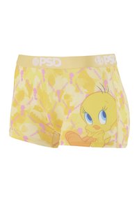 Boxers jaunes avec un personnage de dessin animé Tweety Bird sur le côté et un motif rose avec le mot "Tweety" répété.