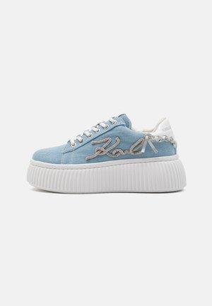 Blue denim platform sneakers with white rubber sole, featuring silver embroidered logo and white accents on heel and lace area.