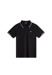 Svart pikétröja med dragkedja i halsen, vit kontrastdetaljering vid kragen och ärmarna, samt en liten logotyp på framsidan.