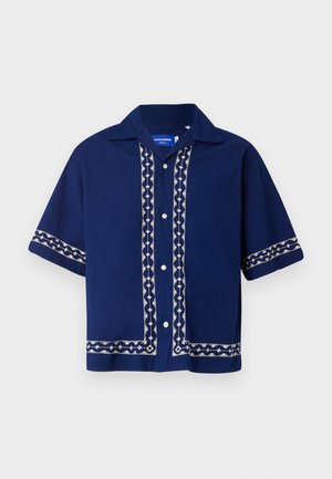 Navy short-sleeve shirt with white embroidered patterns along the button placket and sleeves; features a collared neckline and button closure.