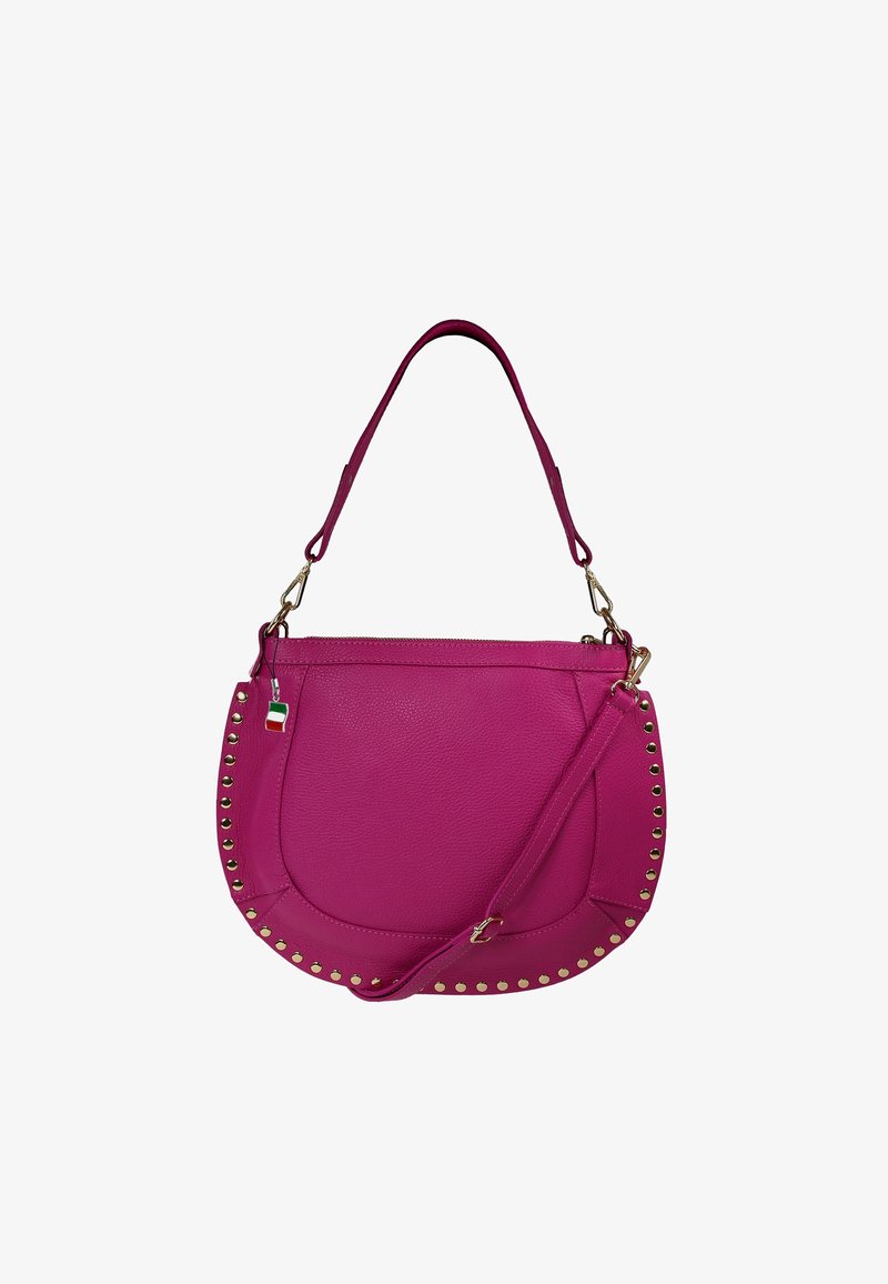 Pink leather handbag with a curved shape, gold studs along the edge, a detachable strap, and a small multicolored tag.
